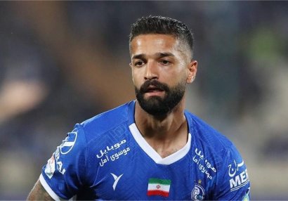 Şərab şüşəsi iranlı futbolçuya baha başa gəldi
